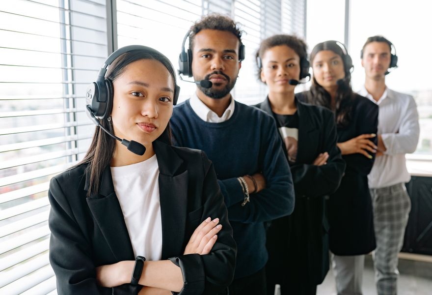 Helpdesk support team wearing headsets